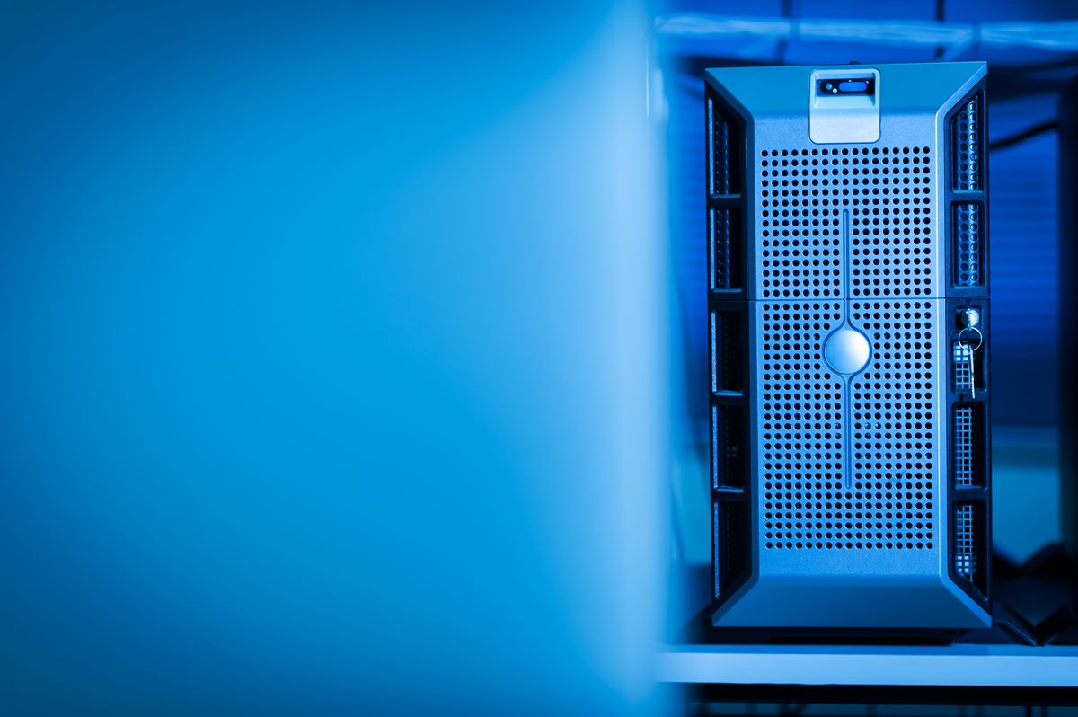 Close-up of a modern server in a data center lit with blue light