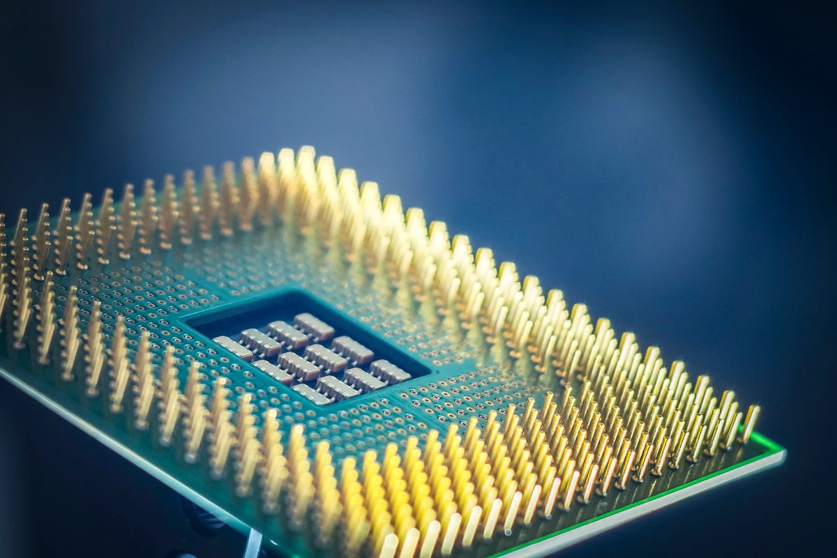 Macro shot of a CPU chip with gold-plated contact pins
